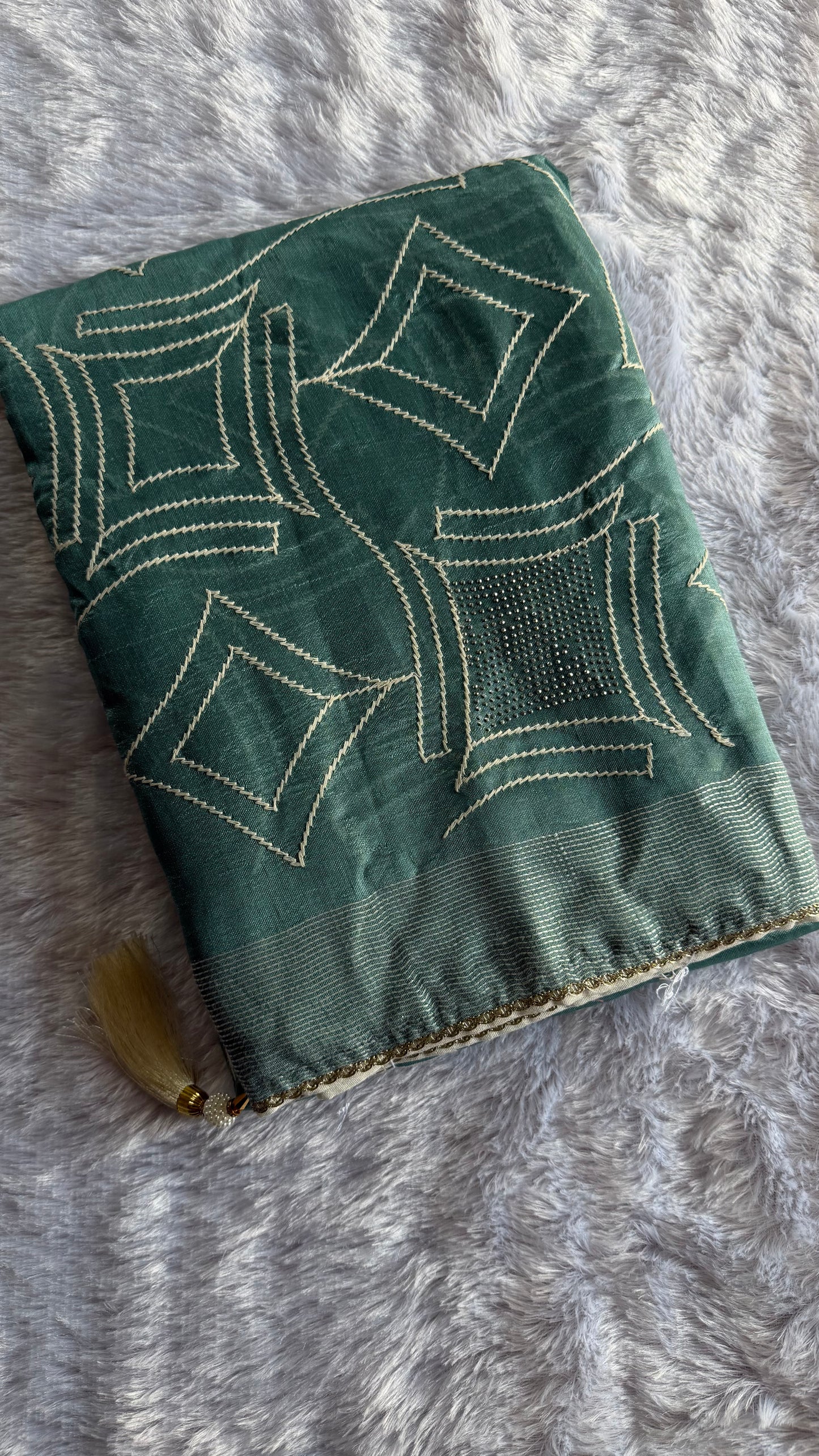 TEAL GREEN SEMI TUSSAR SAREE WITH WHITE ART SILK BLOUSE.