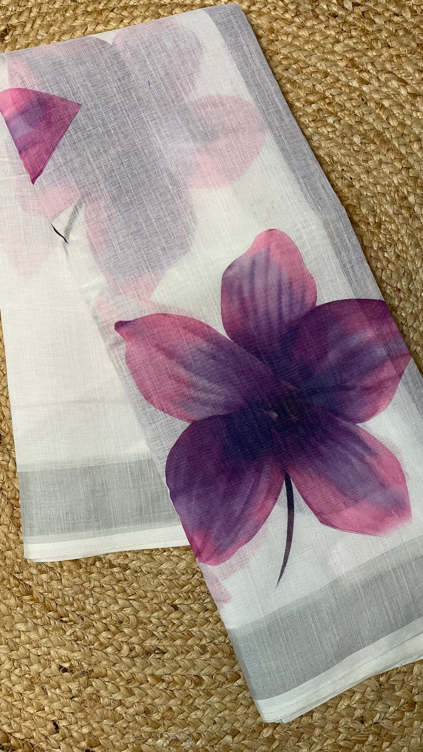 WHITE COTTON SAREE WITH PURPLE FLOWERS.