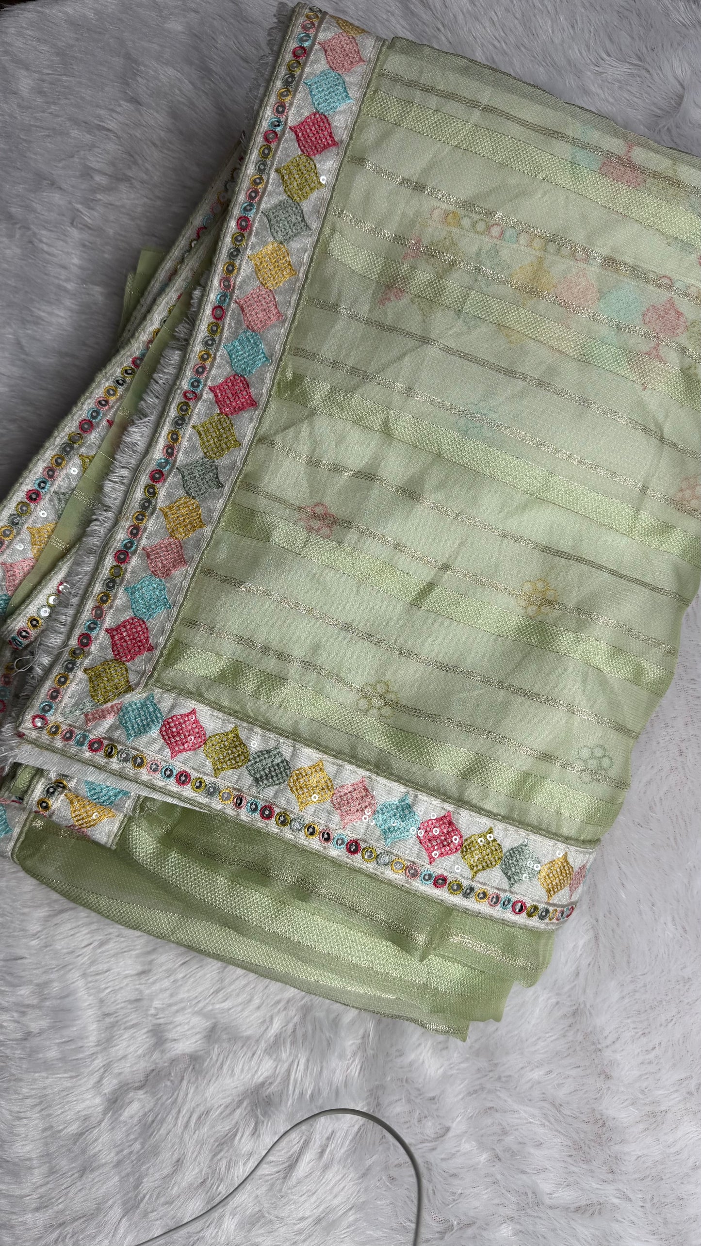 GREEN SOFT NET SAREE WITH DESIGNER BLOUSE.