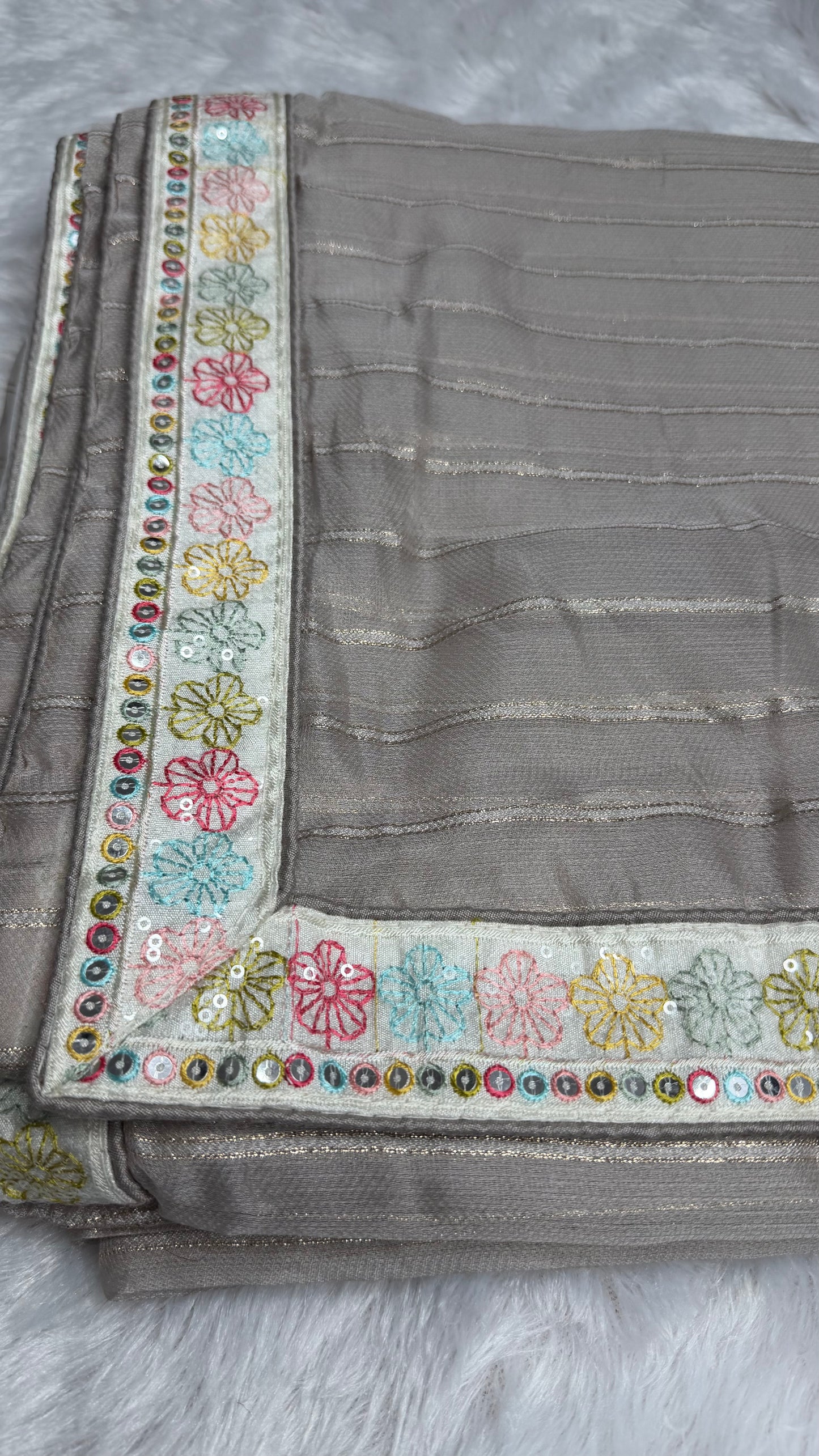 GREY SOFT NET SAREE WITH DESIGNER BLOUSE.