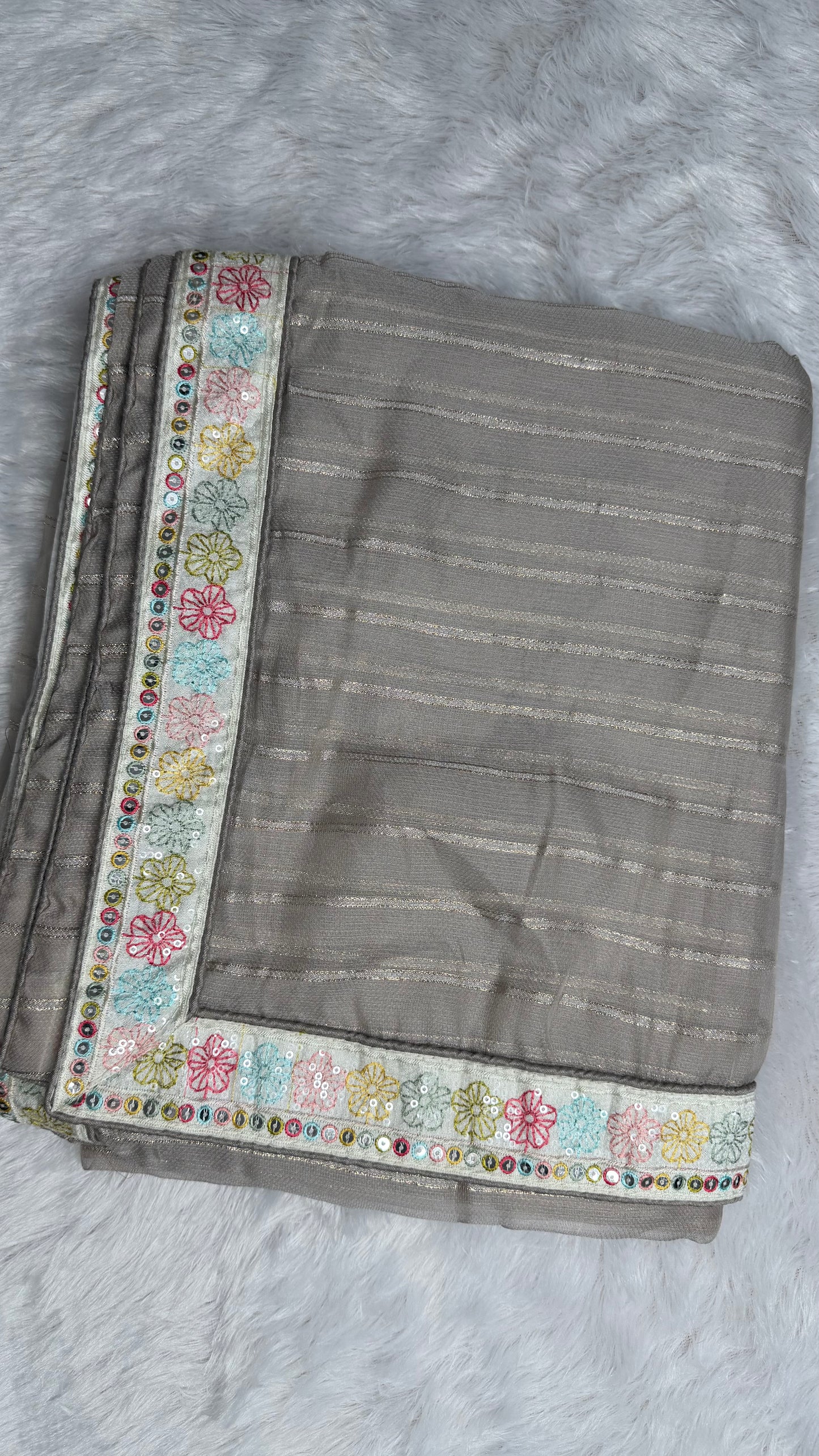 GREY SOFT NET SAREE WITH DESIGNER BLOUSE.