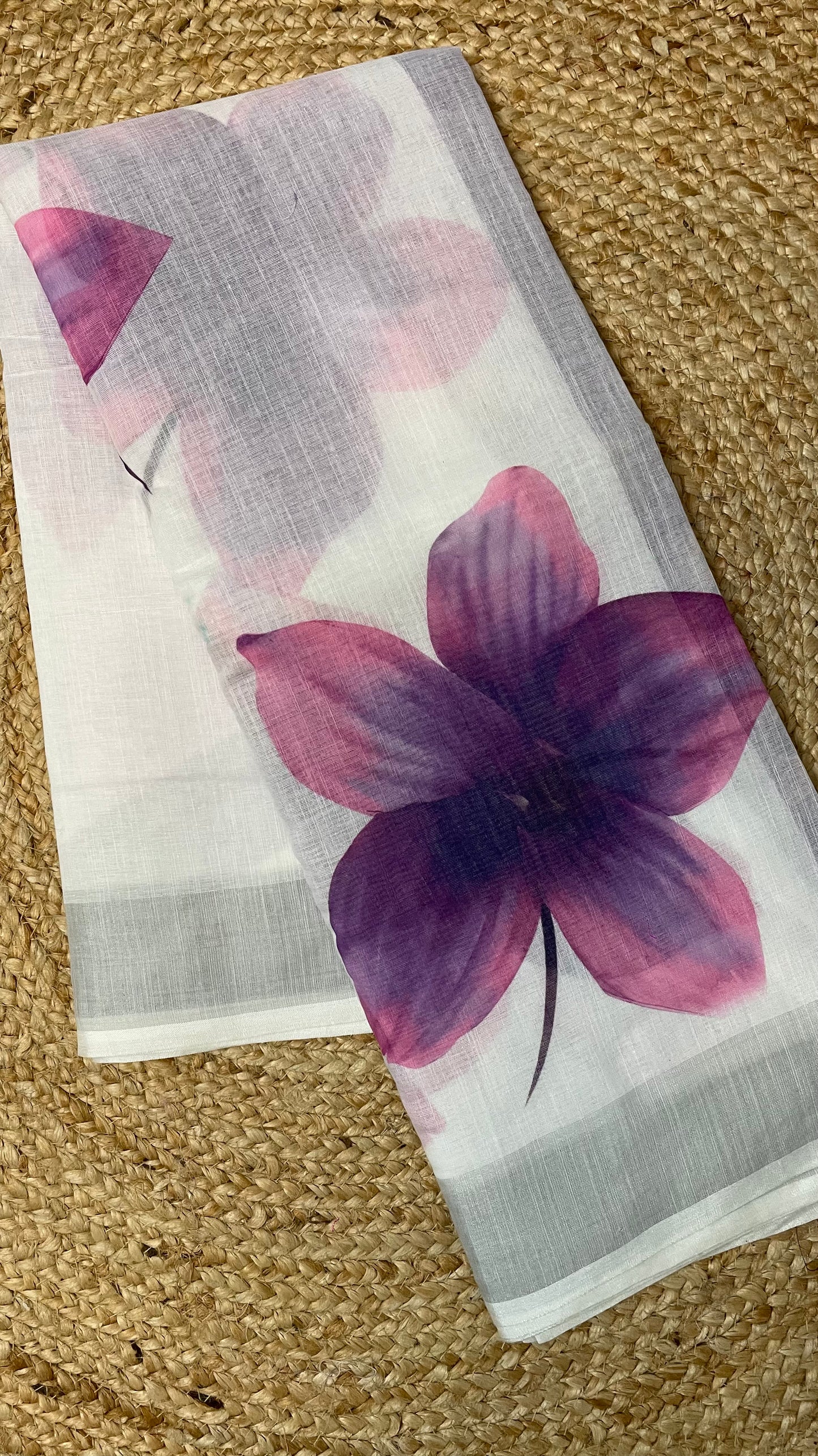 WHITE COTTON SAREE WITH PURPLE FLOWERS.