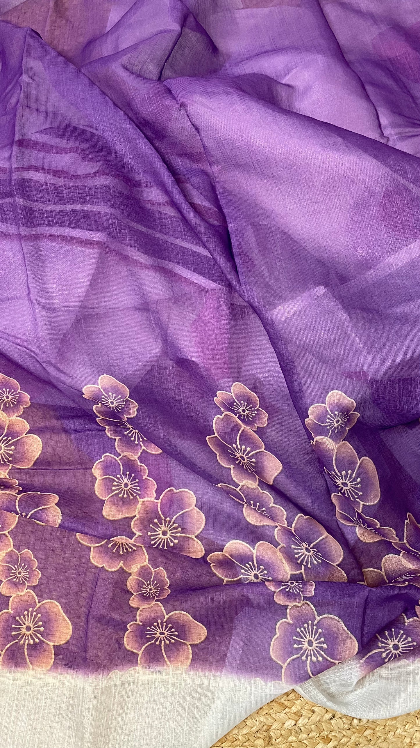 WHITE COTTON SAREE WITH PURPLE FLOWERS.