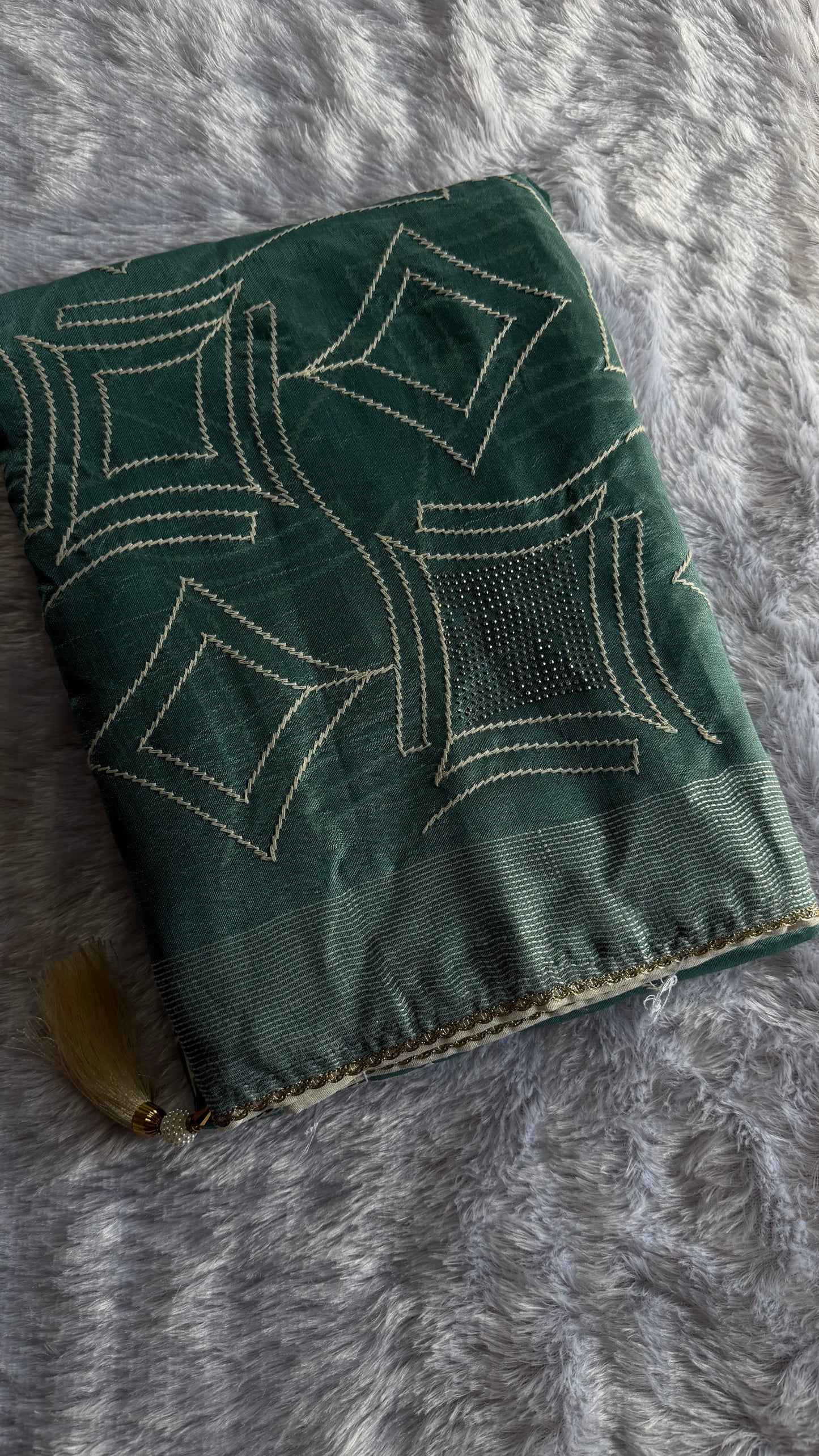 TEAL GREEN SEMI TUSSAR SAREE WITH WHITE ART SILK BLOUSE.