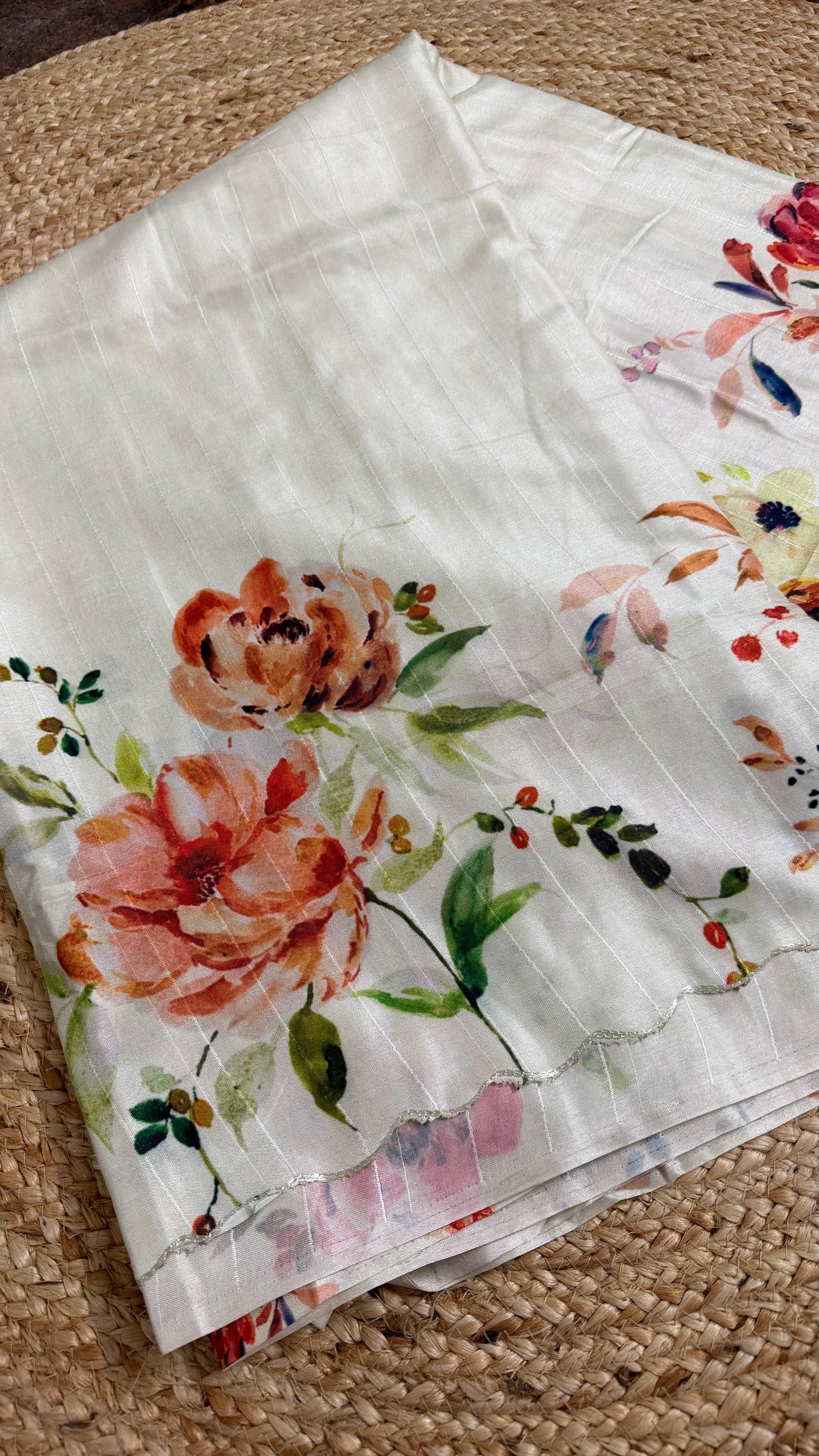 WHITE DOLA SILK SAREE WITH RED FLORAL PRINT.